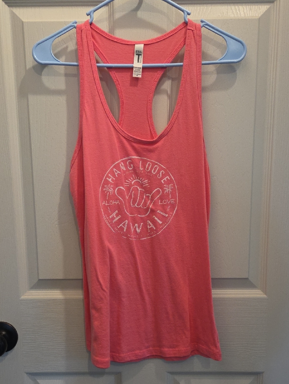 3/$10 Next Level Apparel Coral Pink Racerback Tank with White Hawaii Graphic
